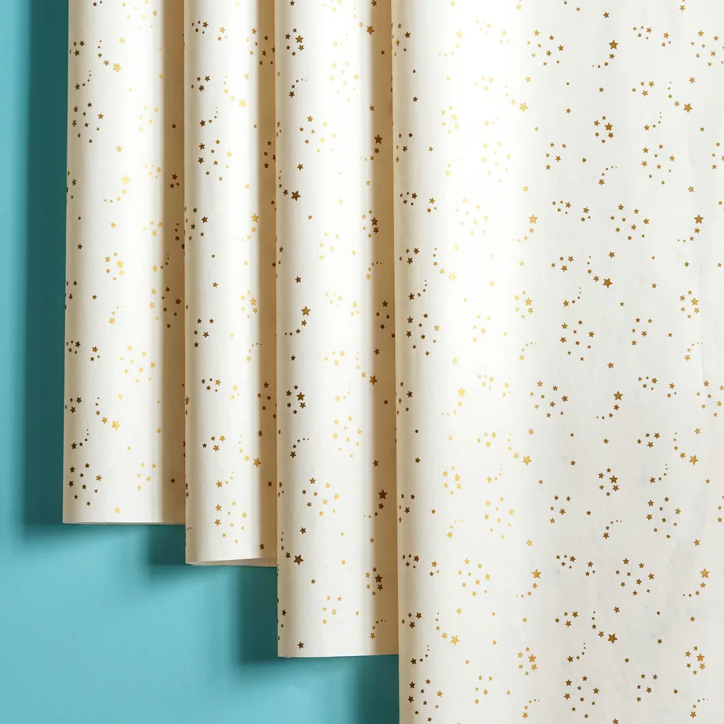 Custom printed tissue paper with metallic gold stars pattern on black