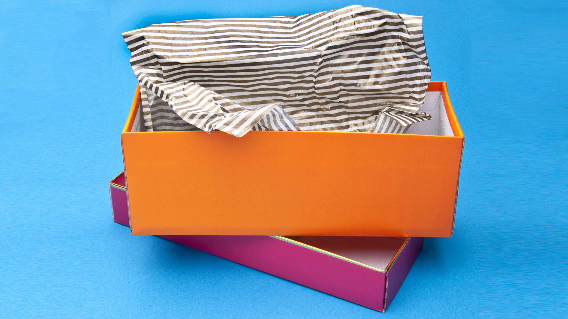 Branded tissue paper folded inside a product box