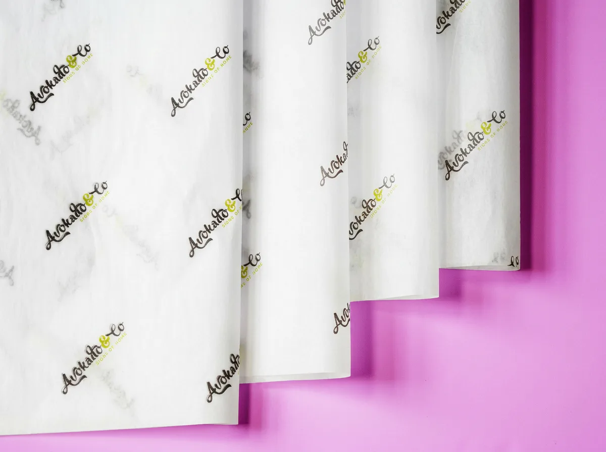 Personalised tissue paper with custom logo creating a premium branded unboxing experience